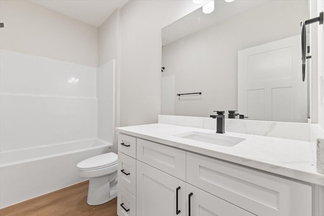 625 NW Georgetown Dr, Waukee, IA 50263 - full bathroom with vanity, wood finished floors, and  shower combination