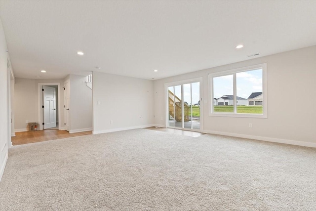 625 NW Georgetown Dr, Waukee, IA 50263 - empty room featuring light colored carpet and recessed lighting