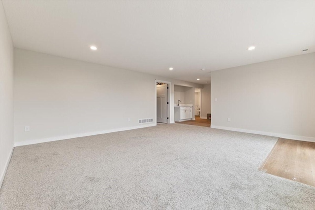 625 NW Georgetown Dr, Waukee, IA 50263 - unfurnished room with light carpet and recessed lighting
