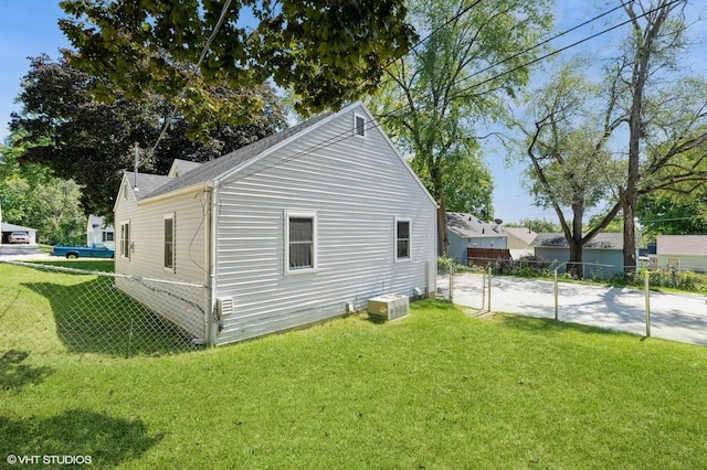 view of side of property with a yard