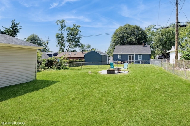 view of yard featuring an outdoor fire pit