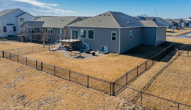 back of property with a patio and a yard