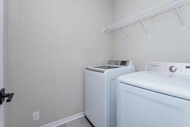 washroom featuring independent washer and dryer