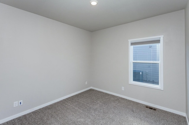 unfurnished room with carpet floors