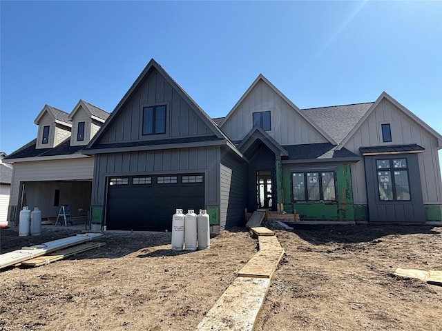 modern inspired farmhouse with board and batten siding and roof with shingles