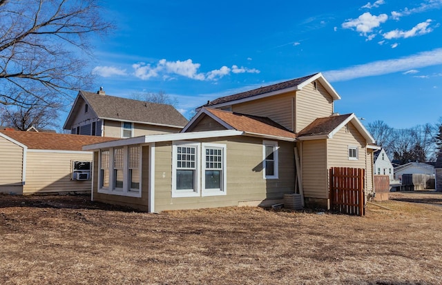 rear view of house with central air condition unit