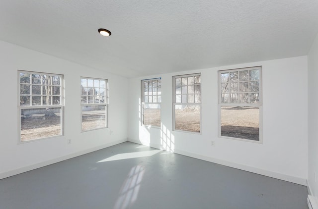 unfurnished sunroom with lofted ceiling