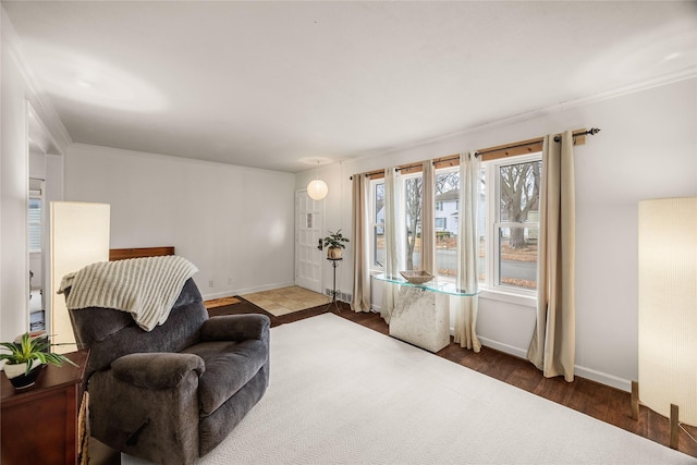 sitting room featuring hardwood / wood-style flooring and crown molding