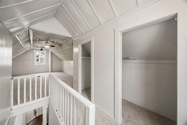 bonus room featuring lofted ceiling and carpet