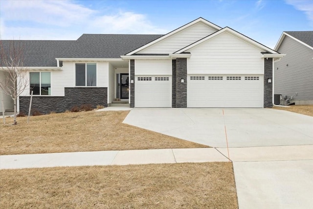 view of front of home featuring a garage and a front yard