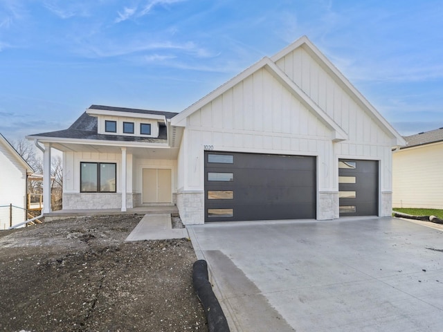 modern farmhouse style home with a garage and a porch