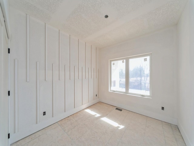 unfurnished bedroom featuring a textured ceiling