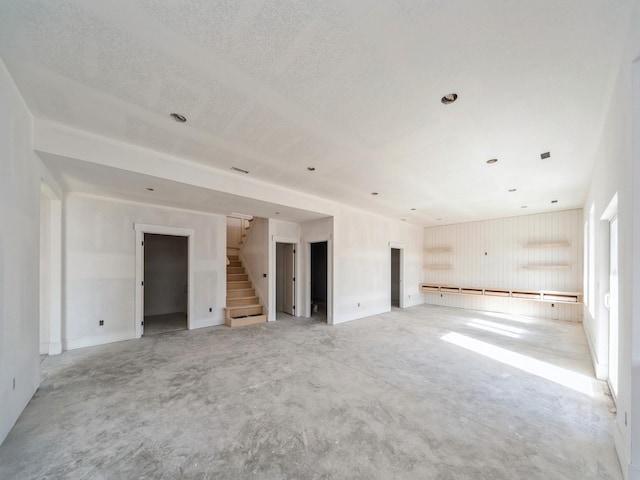 unfurnished room featuring a textured ceiling