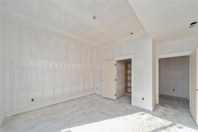 unfurnished bedroom featuring a textured ceiling