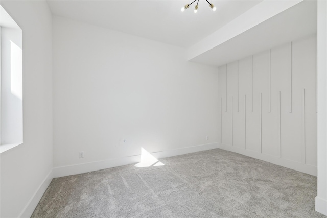 unfurnished bedroom featuring carpet and baseboards