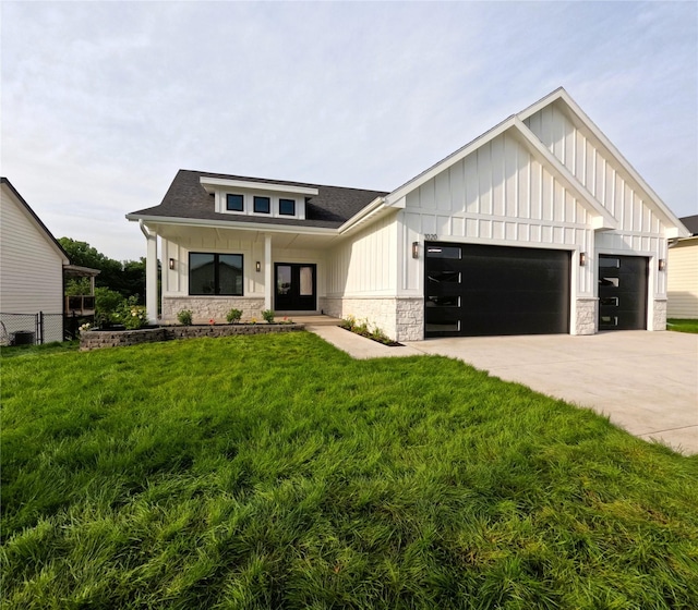 1020 Harrington Way, Waukee, IA 50263 - modern inspired farmhouse featuring board and batten siding, stone siding, a garage, and a shingled roof