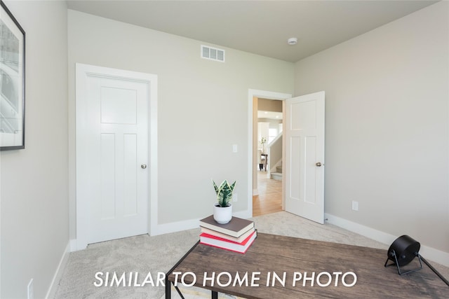 carpeted bedroom featuring baseboards
