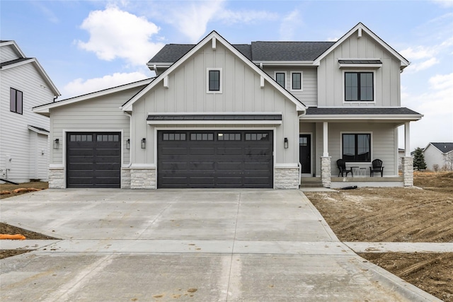 view of front of house featuring a porch and a garage