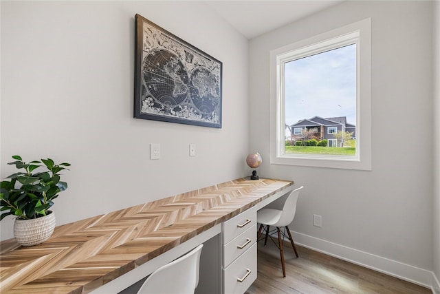 1252 S Radley St, West Des Moines, IA 50266 - office featuring built in study area, healthy amount of natural light, light wood-style flooring, and baseboards
