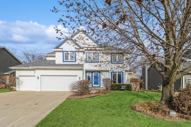 view of front facade with a garage and a front lawn