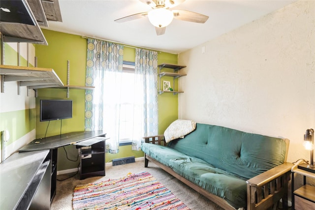 living room with carpet and ceiling fan