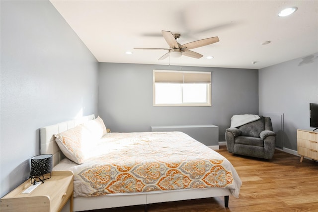 bedroom with ceiling fan and light wood-type flooring