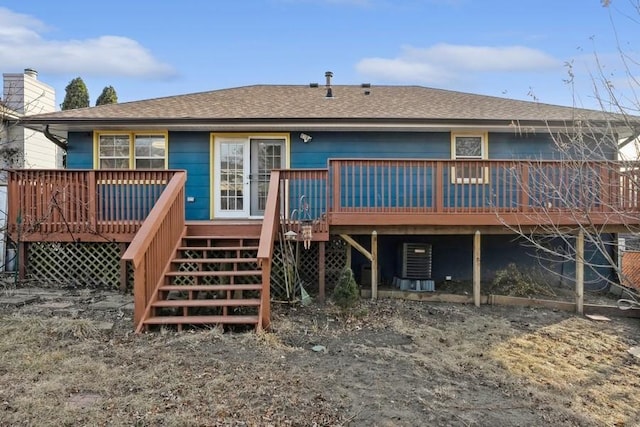 back of house with a wooden deck