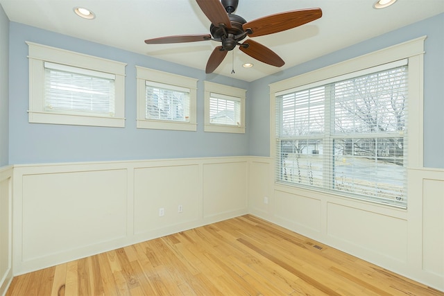 empty room with light hardwood / wood-style flooring