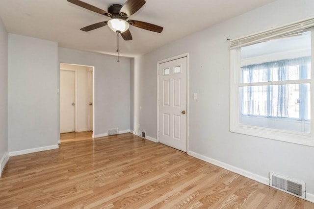 spare room with ceiling fan and light hardwood / wood-style floors