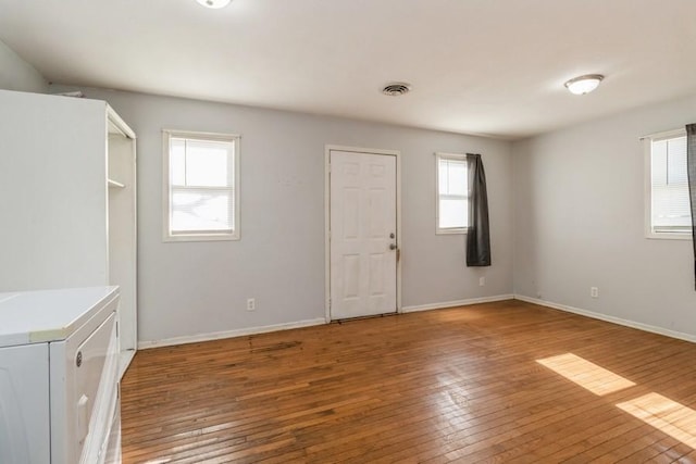 interior space featuring washer / dryer and hardwood / wood-style floors