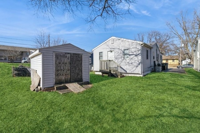 view of outbuilding featuring a lawn