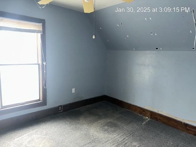 bonus room with ceiling fan and vaulted ceiling