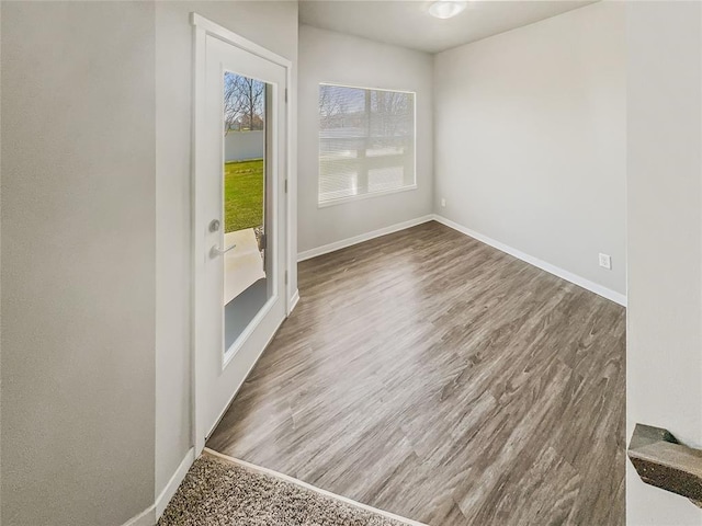 unfurnished room featuring dark hardwood / wood-style flooring