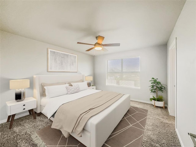 bedroom with ceiling fan and dark carpet