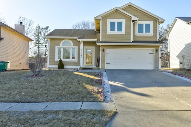 view of front of house featuring a garage and a front lawn