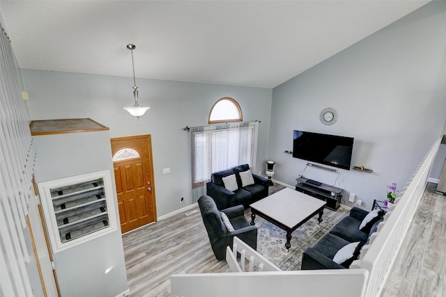 office featuring high vaulted ceiling and light hardwood / wood-style floors