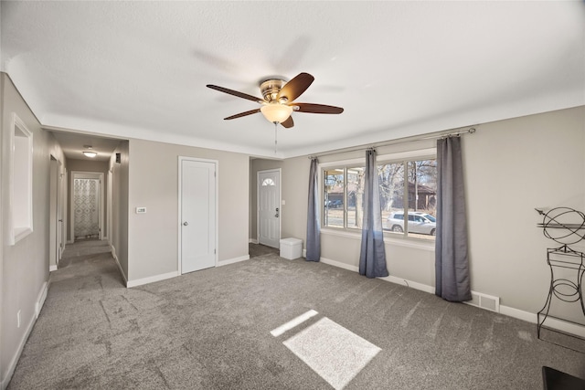 unfurnished bedroom with carpet flooring and ceiling fan