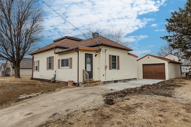 view of front of home featuring a garage and an outdoor structure