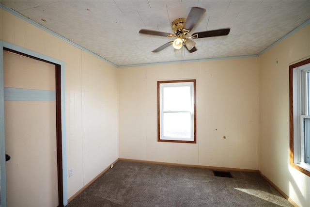 empty room with carpet and ceiling fan