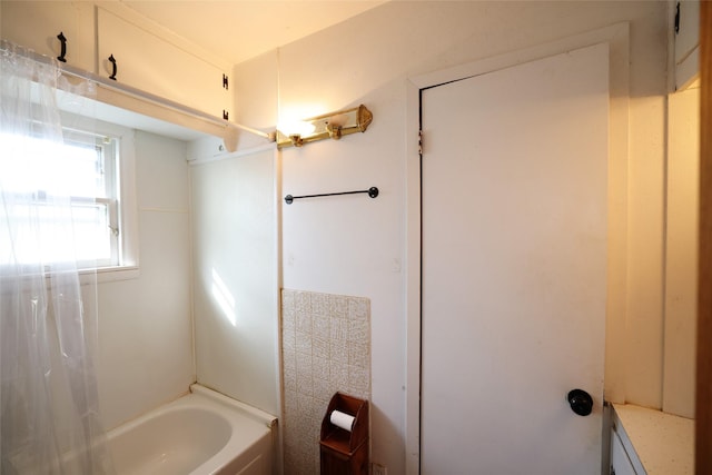 bathroom with shower / bathtub combination