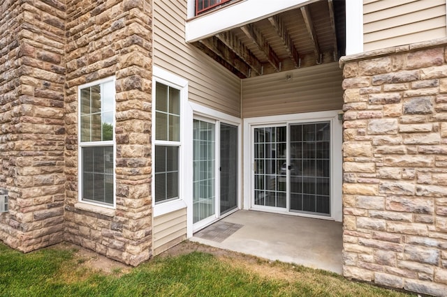 doorway to property featuring a patio area