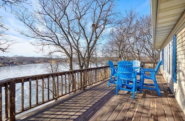 wooden deck featuring a water view