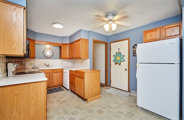 kitchen featuring sink, white appliances, ceiling fan, a textured ceiling, and decorative backsplash