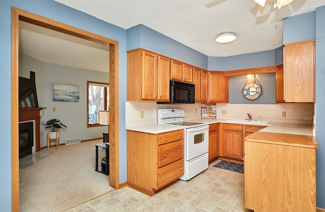 kitchen featuring electric stove, ceiling fan, sink, and backsplash