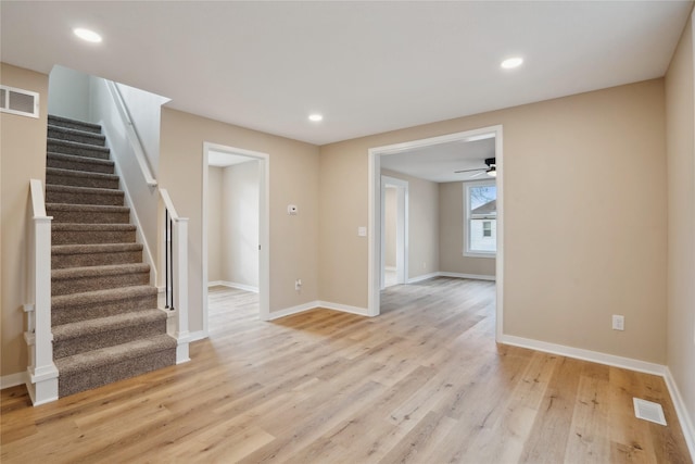 interior space with ceiling fan and light hardwood / wood-style flooring