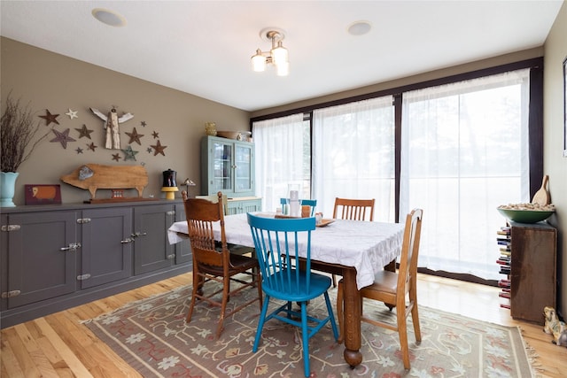 dining area with light hardwood / wood-style floors