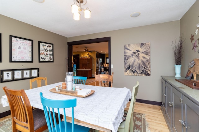 dining space featuring light wood-type flooring