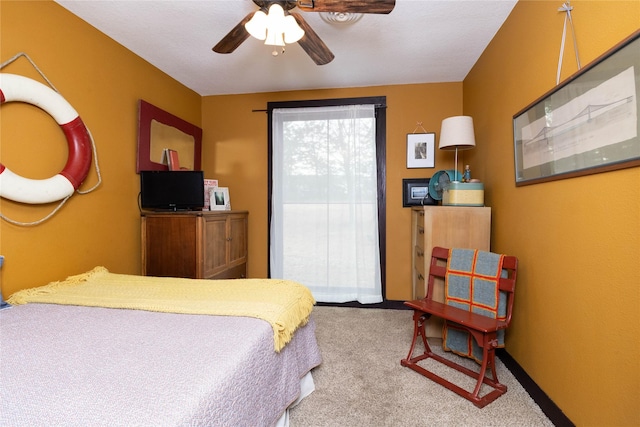 bedroom featuring ceiling fan and carpet flooring