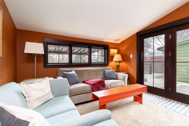 living room featuring vaulted ceiling