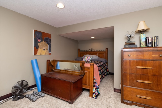 carpeted bedroom featuring a textured ceiling